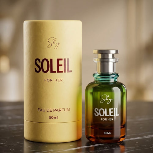 Shy Soleil perfume bottle and packaging on a reflective surface with a blurred background